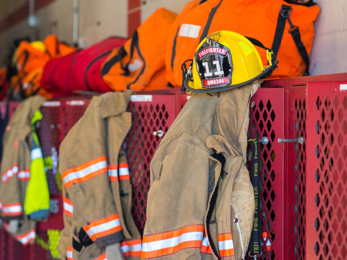 Turnout gear hanging in fire department station